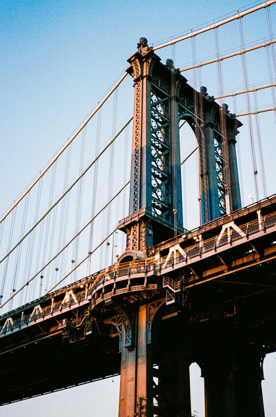 a bridge tower in golden evening light, new york